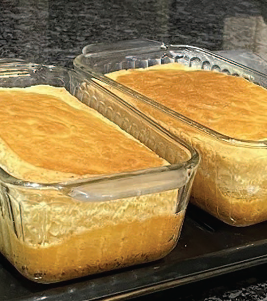 Two loaves of grain-free bread freshly baked in glass loaf pans